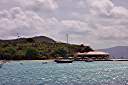 Pusser's Restaurant at Marina Cay. The green roof on the top of the cay is the 