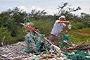 Walker adding to the beach trash sculpture just east of Sprat Point on Beef Island. These impromptu collaborative works of 