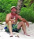 Walker enjoying a Carib at the Sandy Spit