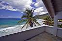 The upstairs balcony view at Malcolm's "Chateau Relaxeau Caribe" on Little Apple Bay.