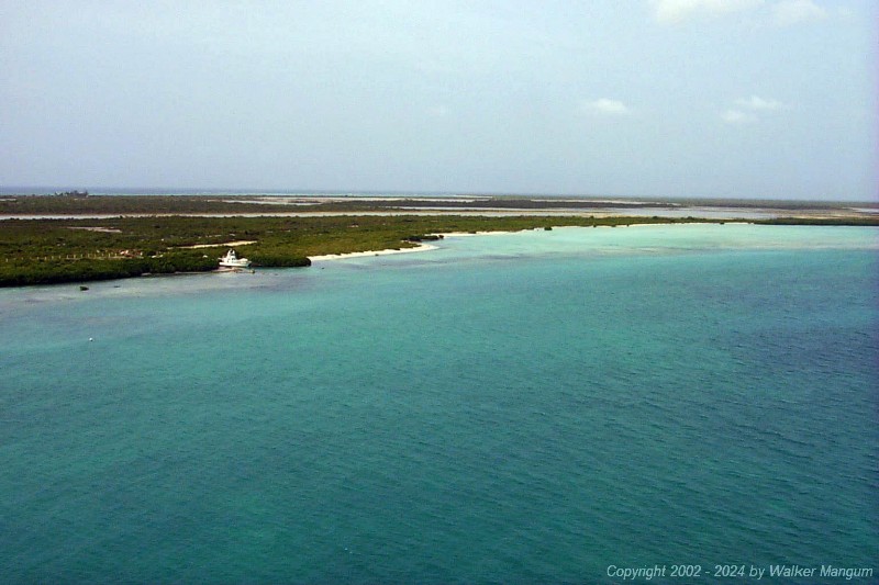 View from Neil's AirCam of the southern shore of Anegada just to the east of Saltheap Point, looking toward Nutmeg Point. The bonefish flats are visible near shore on the right.