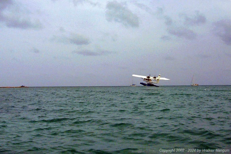 Neil's AirCam taking off in front of the Anegada Reef Hotel.