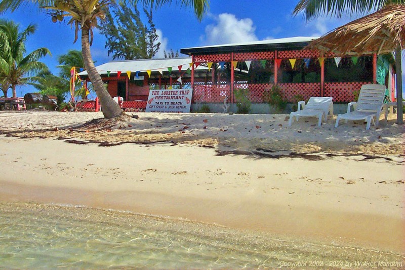 We walked from the Anegada Reef Hotel around the west end of Anegada to Cow Wreck Beach. This photo, taken on the beach in front of the Lobter Trap Restaurant just west of the Anegada Reef Hotel, has a bit of humor in it. The sign says 