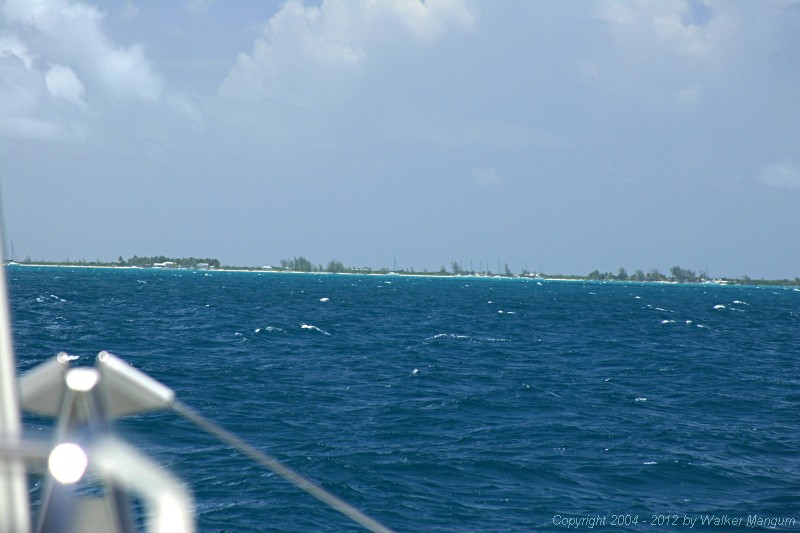 Anegada from two miles out, through a telephoto lens. It is what you would see with a good pair of binoculars.
