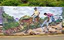 The "Wall", a long and colourful mural along Tortola's Ridge Road, depicts many aspects of BVI heritage.