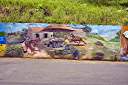 The "Wall", a long and colourful mural along Tortola's Ridge Road, depicts many aspects of BVI heritage.