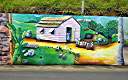 The "Wall", a long and colourful mural along Tortola's Ridge Road, depicts many aspects of BVI heritage.