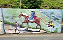 The "Wall", a long and colourful mural along Tortola's Ridge Road, depicts many aspects of BVI heritage.